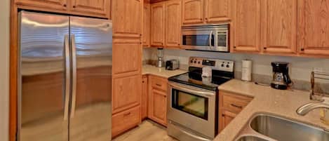 Condo, 3 Bedrooms | Private kitchen | Fridge, microwave, oven, stovetop