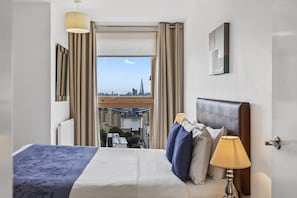 Apartamento | Cortinas blackout, ferros/tábuas de passar roupa, Wi-Fi de cortesia