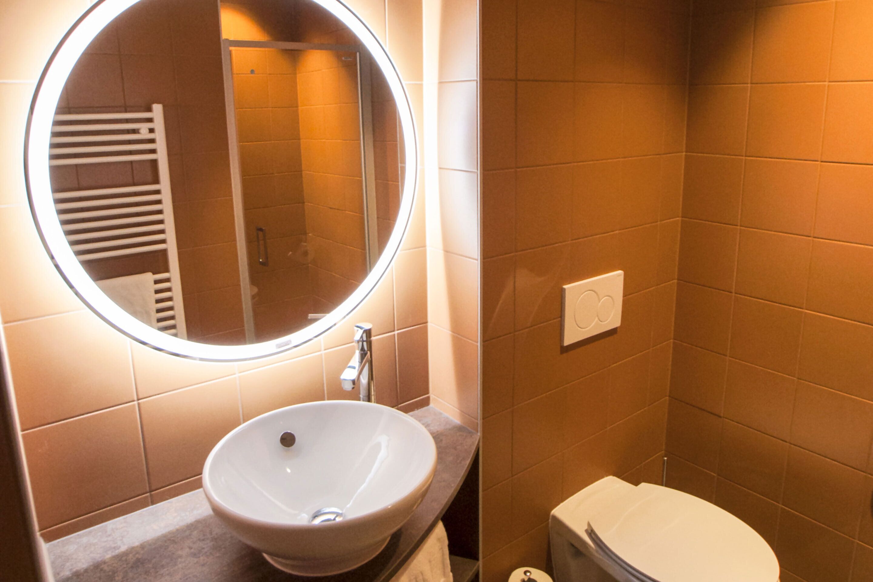 superior room | bathroom | shower, rainfall showerhead, designer toiletries, hair dryer