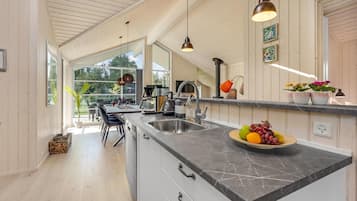 Fridge, stovetop, dishwasher, coffee/tea maker