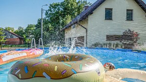 A swimming pool with inflatable toys and water jets. - 2 bedroom amazing home in Ploskinia (Ploskinia)