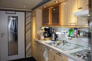 Fridge, microwave, stovetop, coffee/tea maker