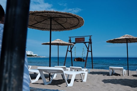 On the beach, free beach cabanas, sun loungers, beach umbrellas