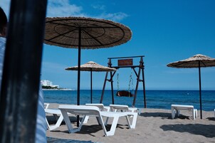 On the beach, free beach cabanas, sun loungers, beach umbrellas