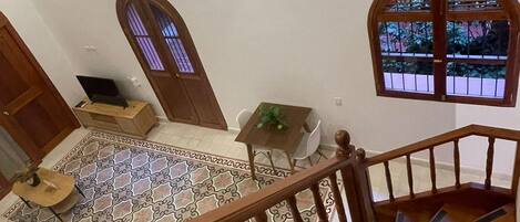A staircase with wooden railings leading to a lower level.