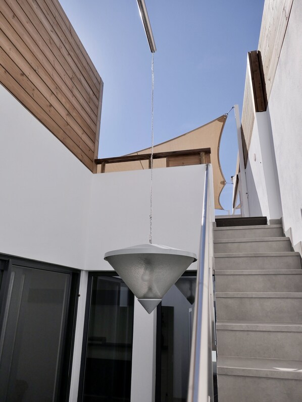 A modern building with a staircase leading to a second floor.