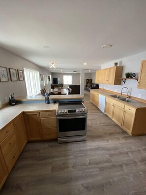 Fridge, microwave, oven, stovetop - Modern Luxury Home on the River w/ 3 Bedrooms (Dubois)