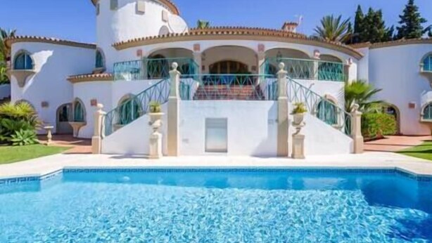 A large, white building with a pool in front. - Palatial Villa in Hacienda Las Chapas, Marbella (Marbella)