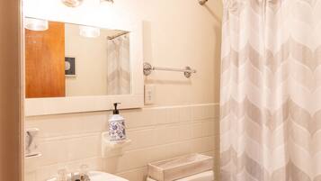 Shower, towels, soap, toilet paper