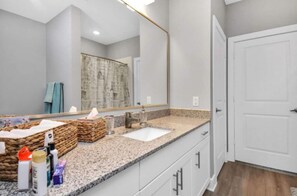 Combined shower/bathtub, hair dryer, towels, soap