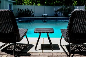 Outdoor pool, a heated pool - Colonial style 5BR/5BA home tucked in a private, wooded setting w/pool & hot tub (Stevensville)