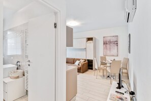 Living area - GuestHost - Brand new apartment located in Cernobbio, a charming town on the shores of Lake Como! The area is elegant and residential, with 3 big supermarkets nearby, as well as pharmacies, bars and restaurants! Bus stop heading to Como and Menaggio at 5 (Cernobbio)
