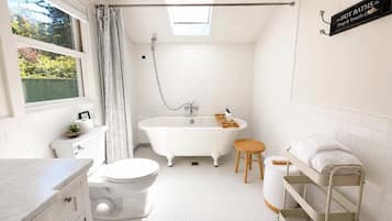 Bathtub, hair dryer, towels