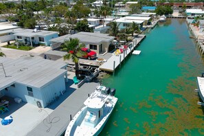 Enjoy waterfront views of docked boats and surrounding residential buildings.