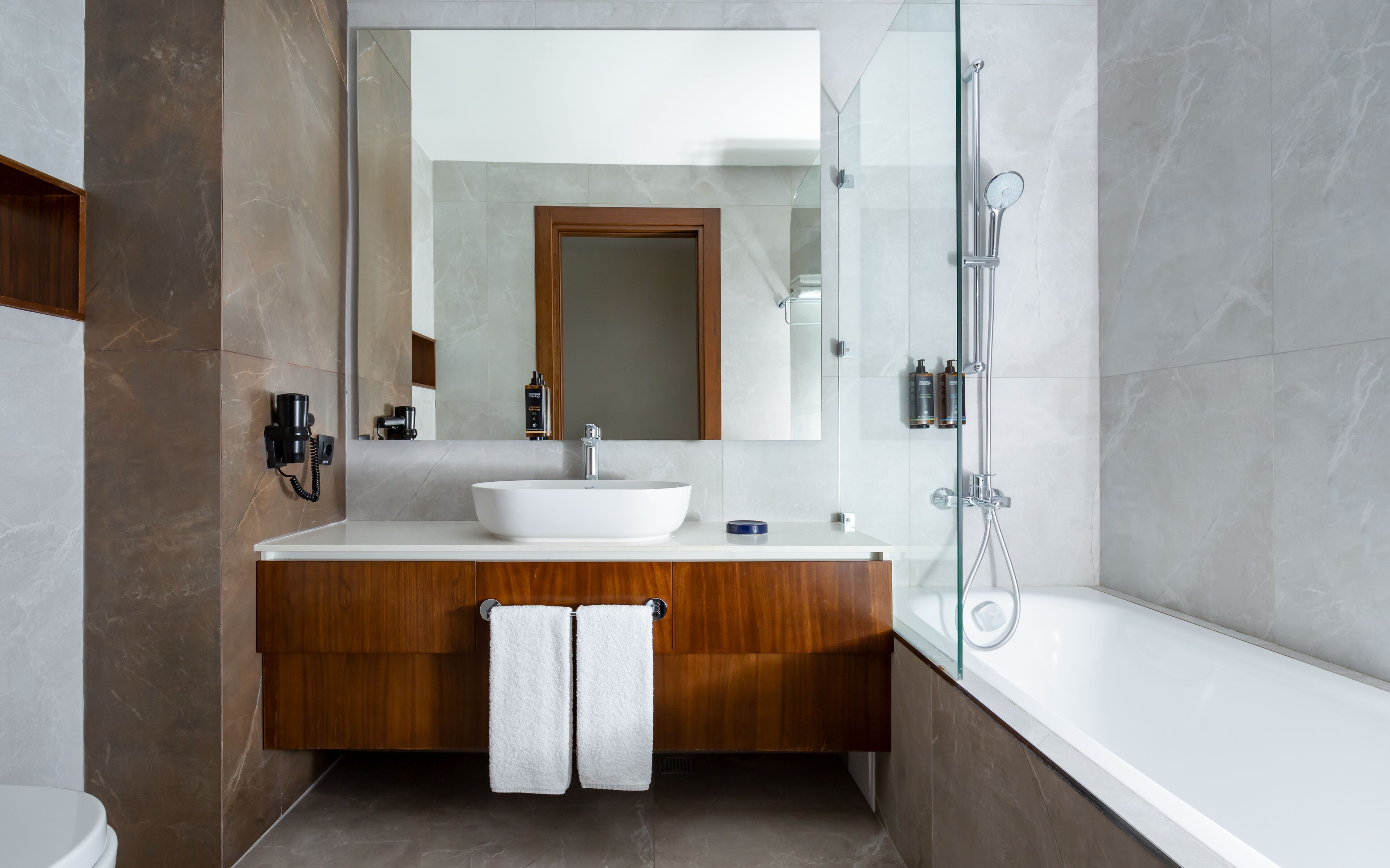 deluxe twin room, 2 queen beds | bathroom | eco-friendly toiletries, hair dryer, dressing gowns, slippers