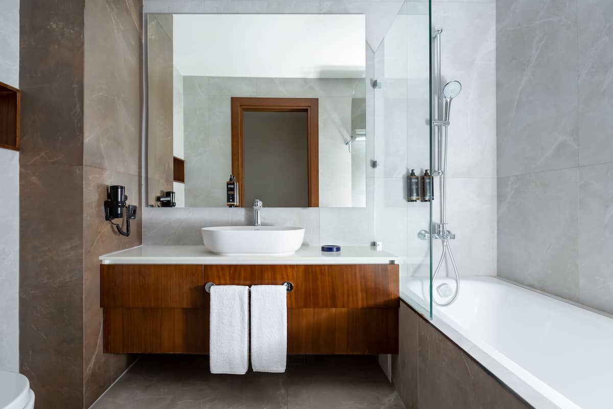 deluxe twin room, 2 queen beds | bathroom | eco-friendly toiletries, hair dryer, dressing gowns, slippers