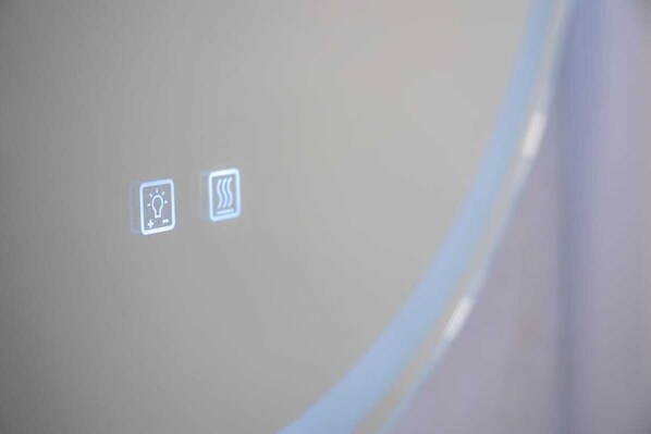 A projection of icons on a wall, including a light bulb and a Wi-Fi symbol.