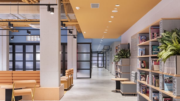 A modern library with bookshelves, seating areas, and a clear path through the space. - Residencia Universitaria Resa San Mamés - Campus Accomodation (Bilbao)