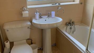 Combined shower/tub, towels, soap, toilet paper