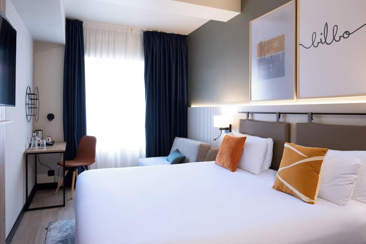 Desk, blackout drapes, soundproofing, iron/ironing board