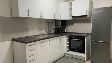 Apartment, 1 Bedroom | Private kitchen | Full-sized fridge, microwave, oven, stovetop