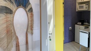 A modern kitchen with a microwave, a small refrigerator, and a sink. - BR156166 - Apartamento  Bela Vista 50 meters from Hosp Sírio Libanês with Garage (São Paulo)