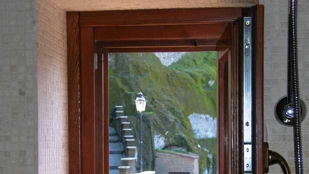A bathroom with a window, a shower, and a mirror. - Ancient Rural Tower in Tuscia Area, Near Viterbo Italy (Vignanello)