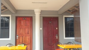 A hotel entrance with two doors labeled HS-IB and HS 2.