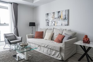 Classic Apartment | Living area | 32-inch LCD TV with cable channels, TV, Netflix - HiGuests - Princess Tower (Dubai)