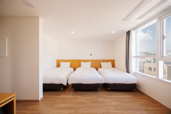 Deluxe Triple Room | Premium bedding, down comforters, desk, laptop workspace