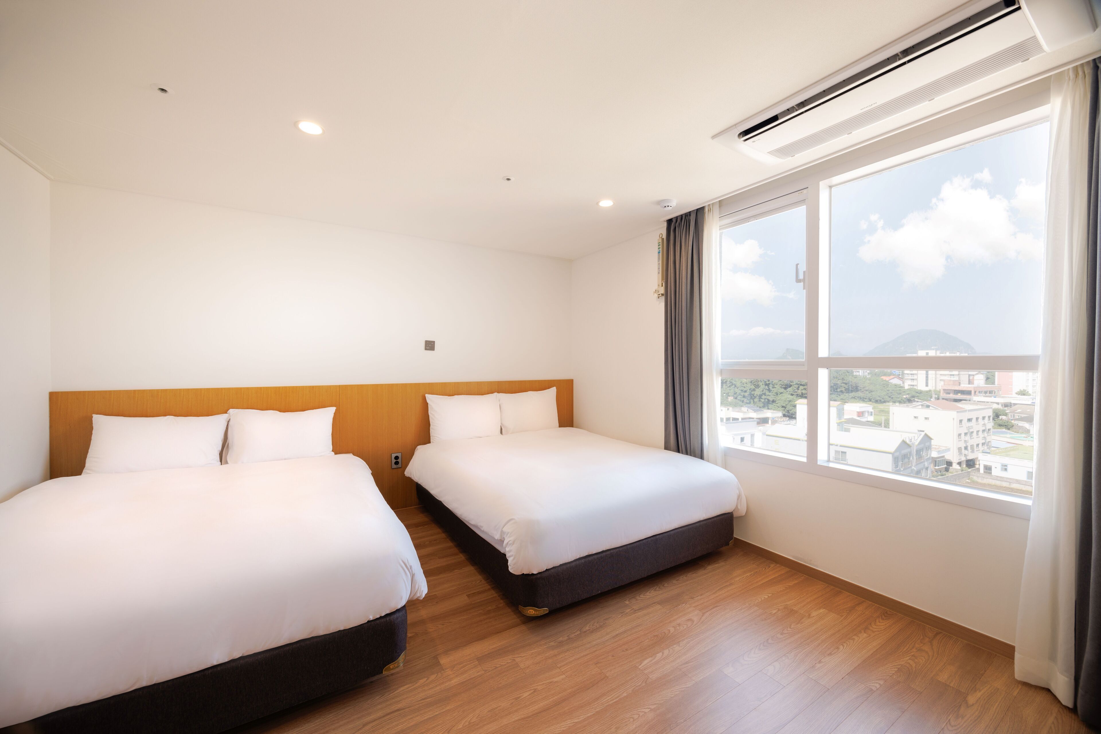 deluxe quadruple room, 2 double beds | premium bedding, down duvets, desk, laptop workspace