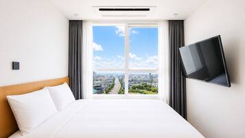 Premium bedding, down duvets, desk, laptop workspace