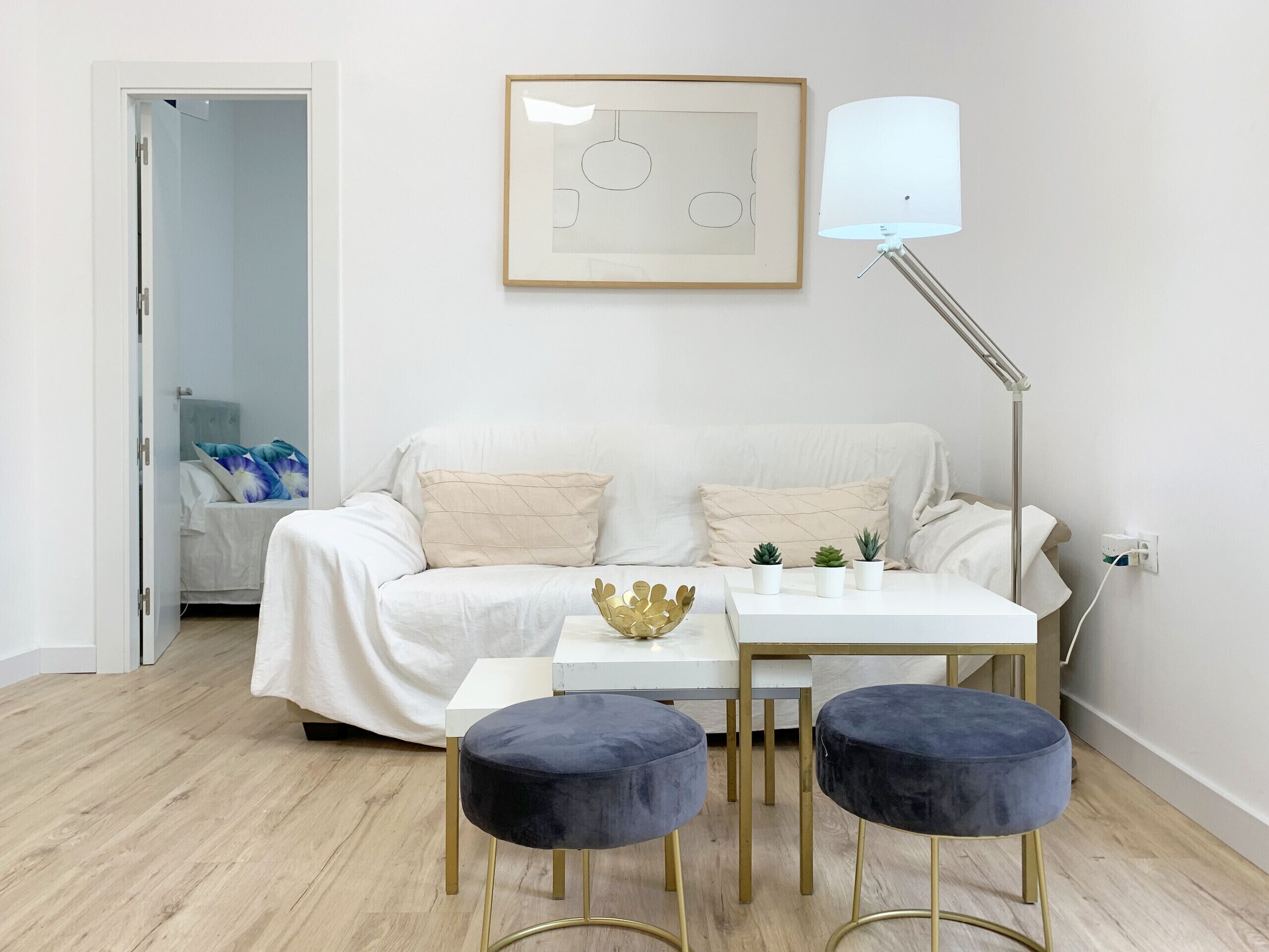 Well-lit living room with comfortable furniture, sofa bed, air conditioning and all the amenities