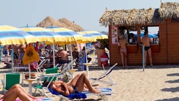 Private beach, white sand, beach umbrellas, beach volleyball