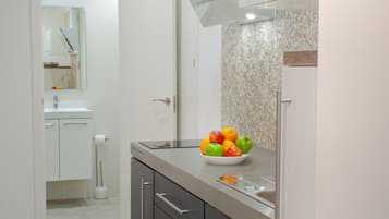 Apartemen, 1 kamar tidur, balkon | Area keluarga | TV layar datar