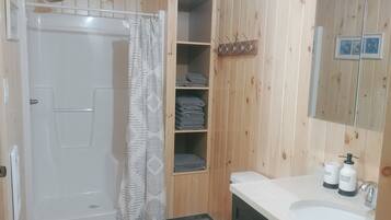 Shower, hair dryer, towels, toilet paper