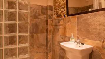 Bathtub, hair dryer, towels, soap