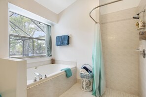Combined shower/tub, towels, soap, shampoo