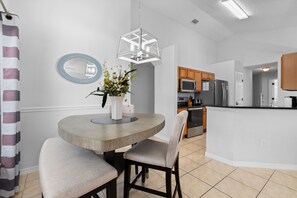 A modern kitchen with a built-in oven, microwave, and refrigerator. - 463 -4 bedroom villa with south facing private pool & Spa (Kissimmee)