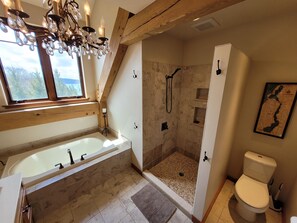 Bathtub, hair dryer, towels, soap
