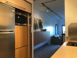 Fridge, microwave, coffee/tea maker, cookware/dishes/utensils