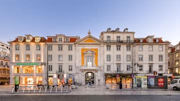 A historic building with a central entrance, multiple stories, and a traditional European architectural style.