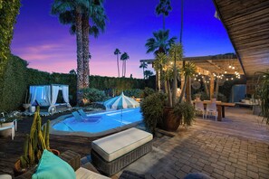 A pool area with lounge chairs, a small tent, and a wooden deck. - Joplin House - Poolside Paradise w/ Amazing Views! (Palm Springs)