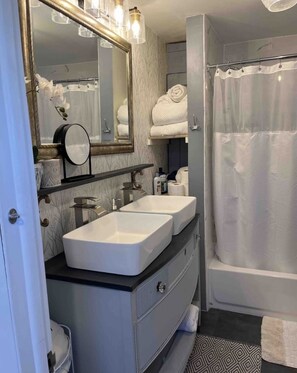 Combined shower/tub, hair dryer, towels, soap