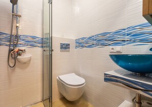 Shower, towels, toilet paper