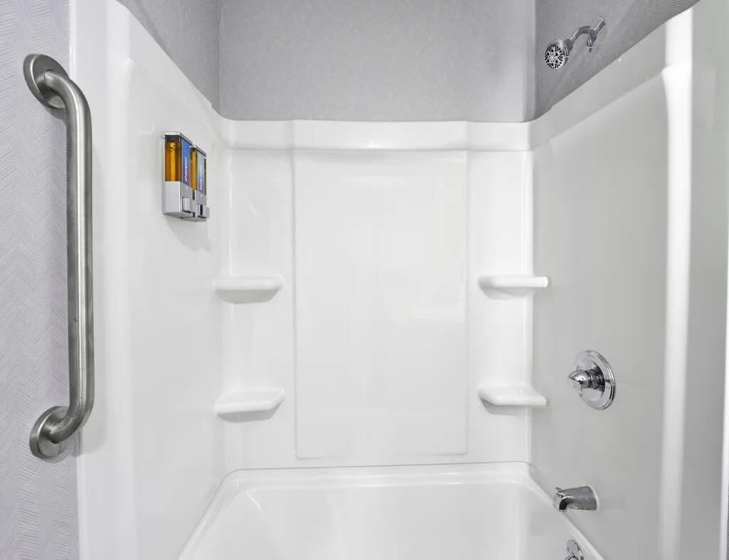 Bathtub, hair dryer, towels, soap