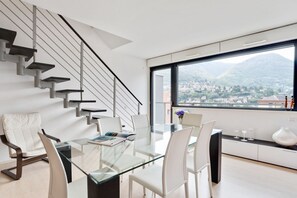Dining - GuestHost - La Perla apartment is located in a newly built condominium, located in a panoramic residential area of Como, on the border with Cernobbio. The location is highly suggested for exploring both the city and the villages on the western coast of (Como)