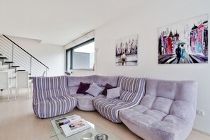 Living area - GuestHost - La Perla apartment is located in a newly built condominium, located in a panoramic residential area of Como, on the border with Cernobbio. The location is highly suggested for exploring both the city and the villages on the western coast of (Como)