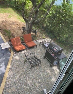 Private outdoor patio set up with new grill!