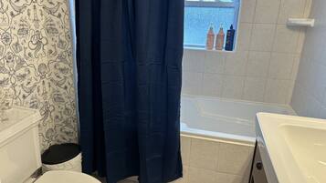 Combined shower/tub, hair dryer, towels, soap